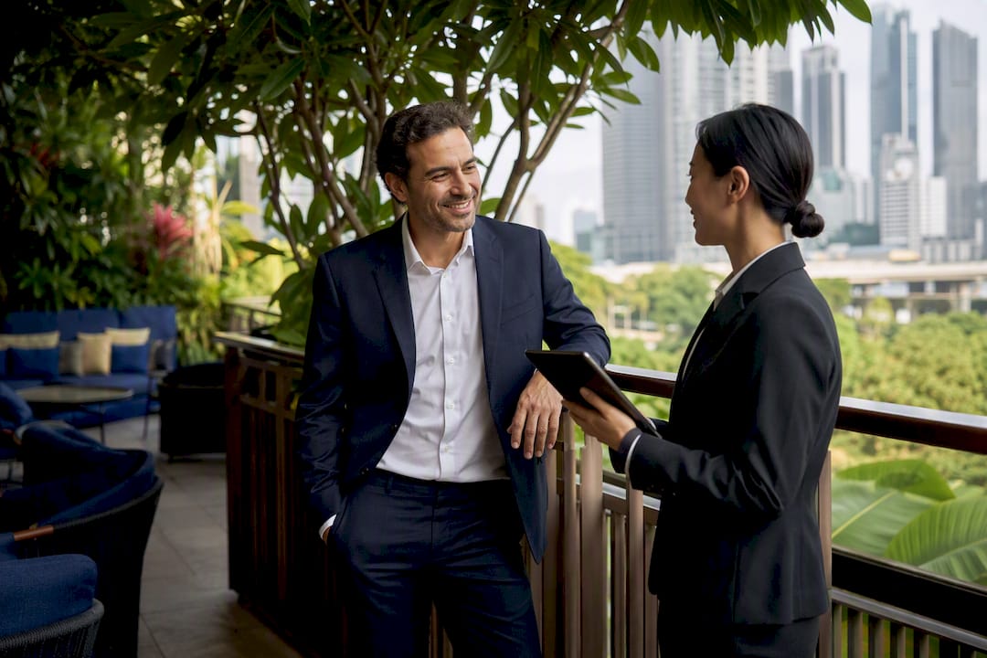 Business traveler showing corporate ID at hotel check-in