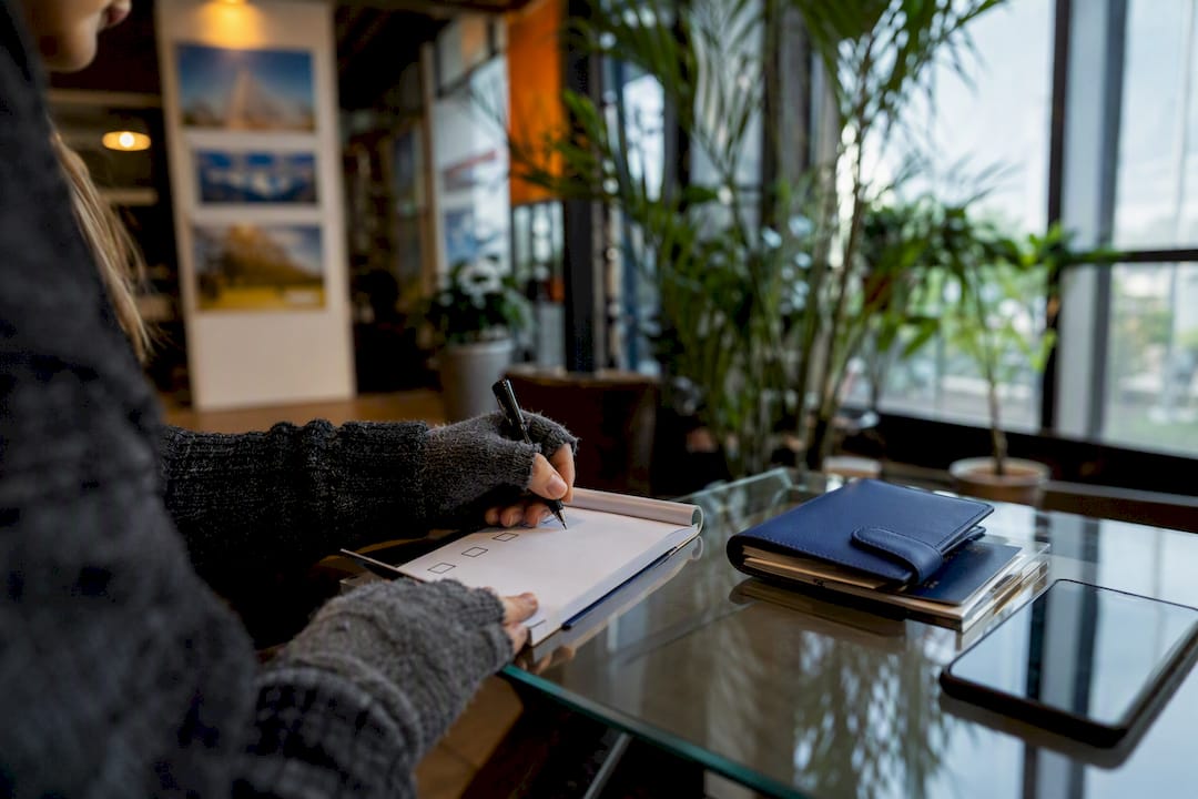 Hand checking travel documents checklist
