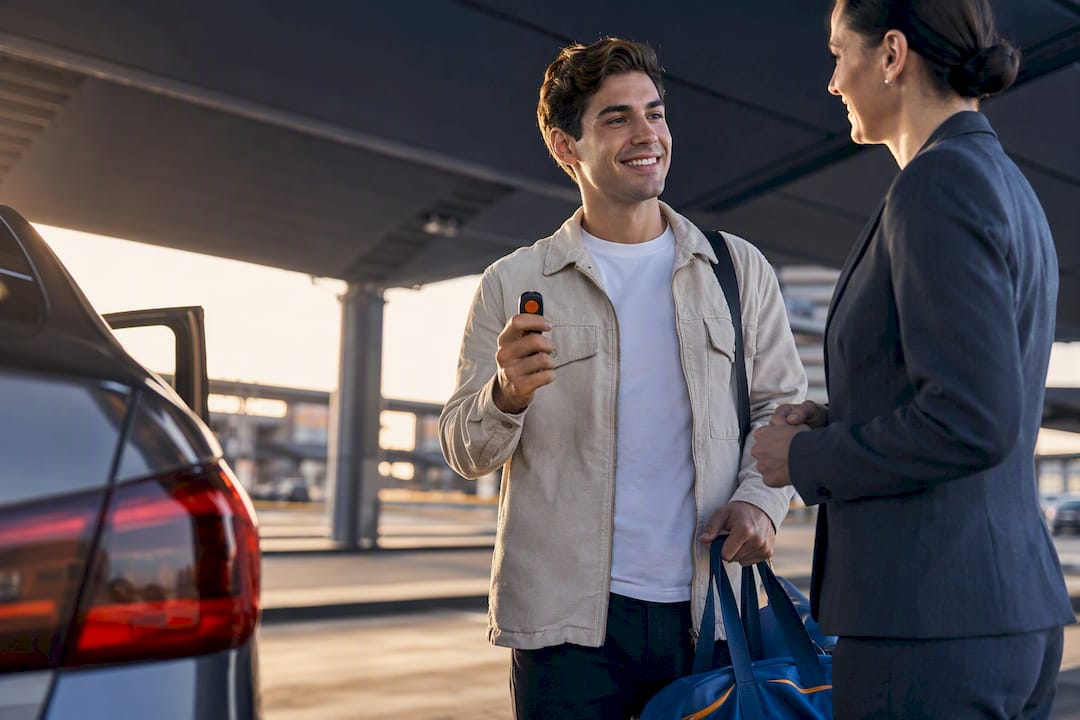 Young renter confirming vehicle pickup