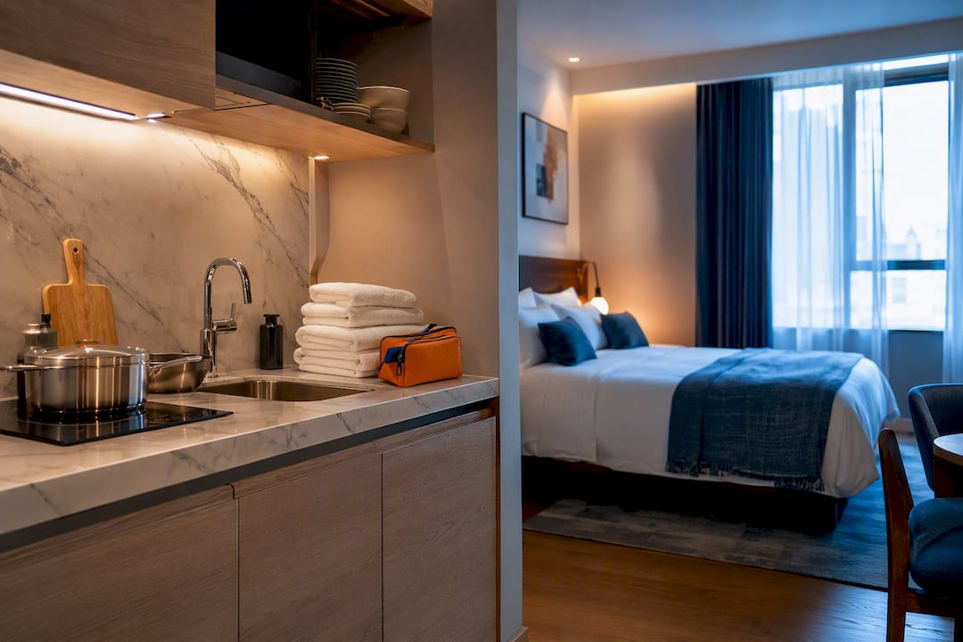 Serviced apartment kitchenette and sleeping area