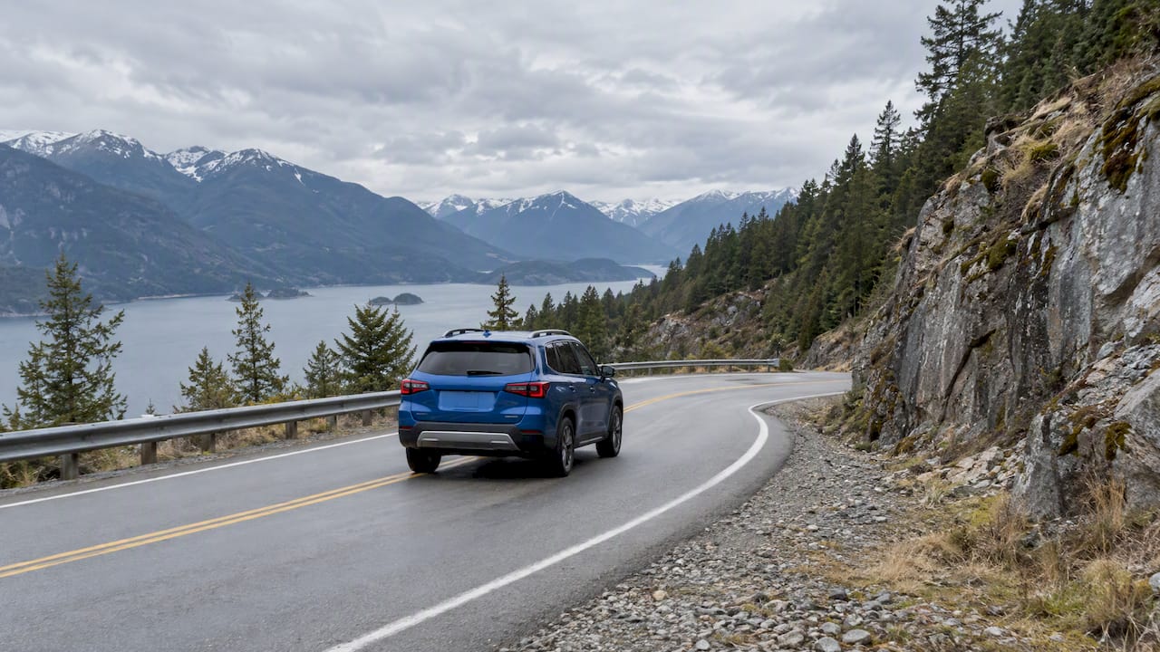Midsize SUV driving on a mountain road